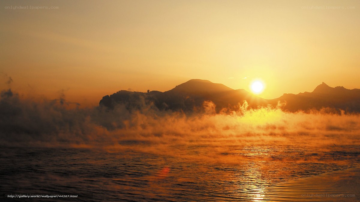Sunrise over misty mountains