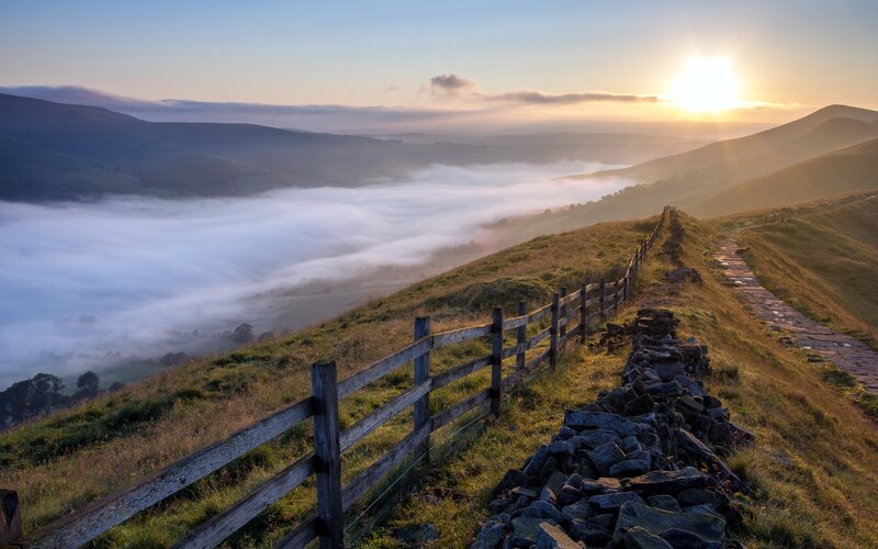 Sunrise over misty valley