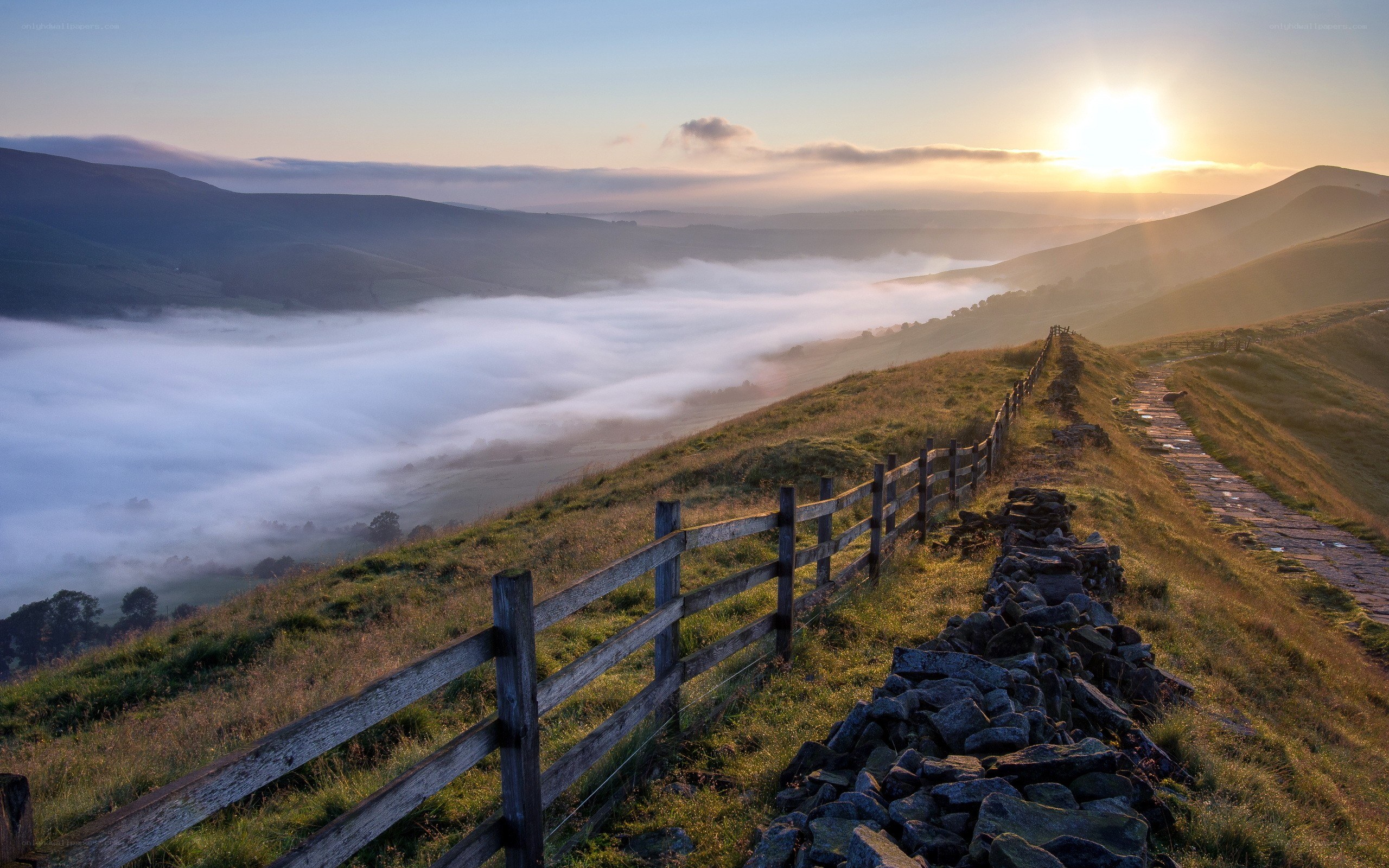 Sunrise over misty valley