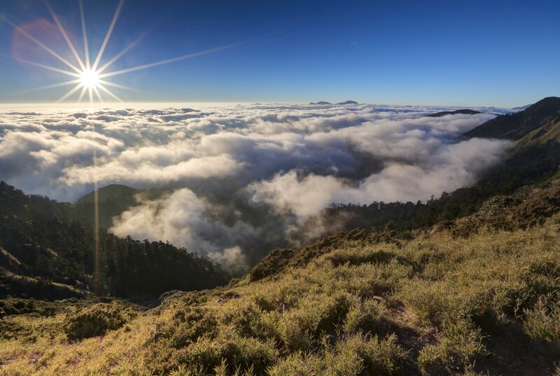 Sunrise over mountain clouds
