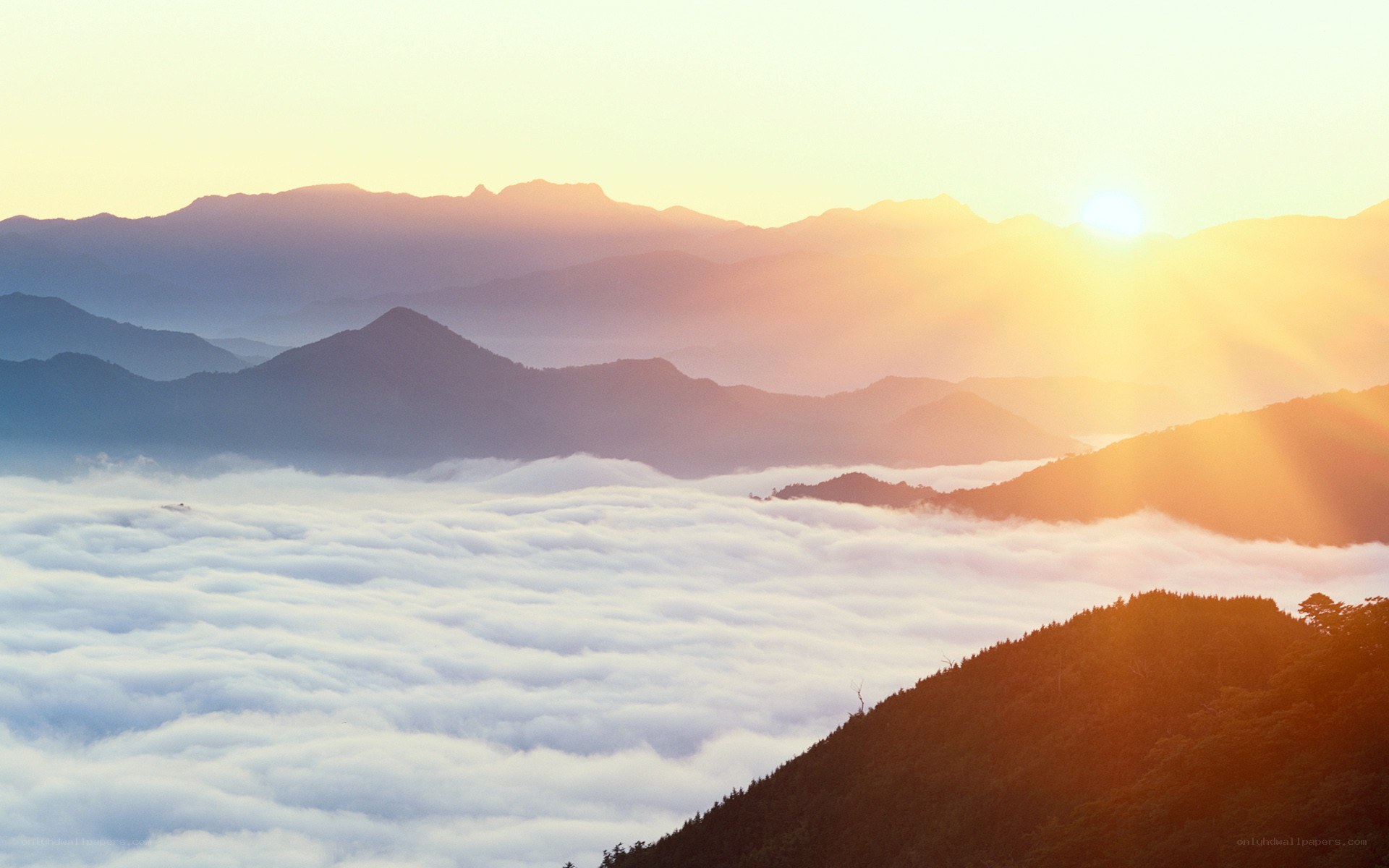 Sunrise over mountain clouds
