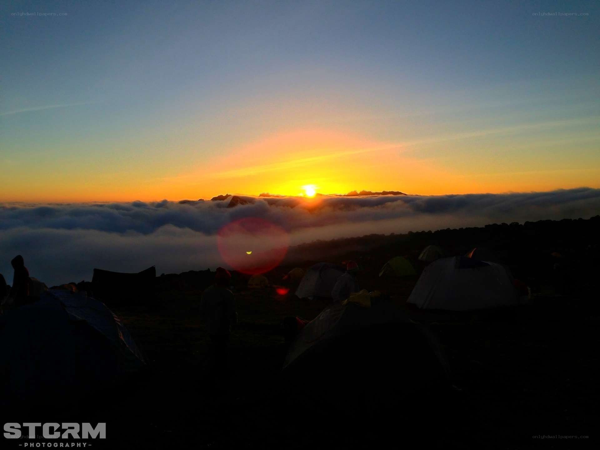 Sunrise over mountain clouds