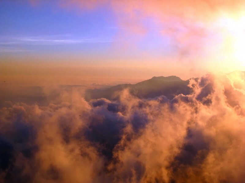 Sunrise over mountain clouds