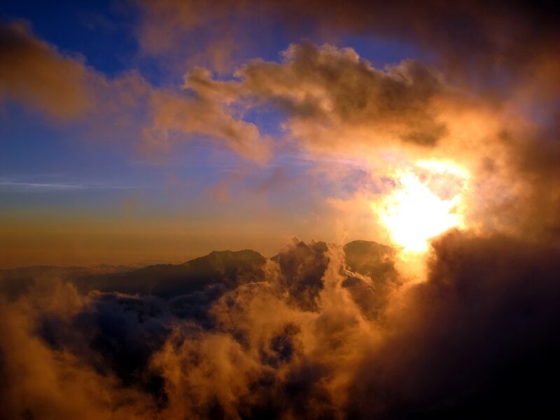 Sunrise over mountain clouds