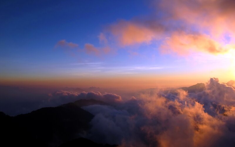 Sunrise over mountain clouds