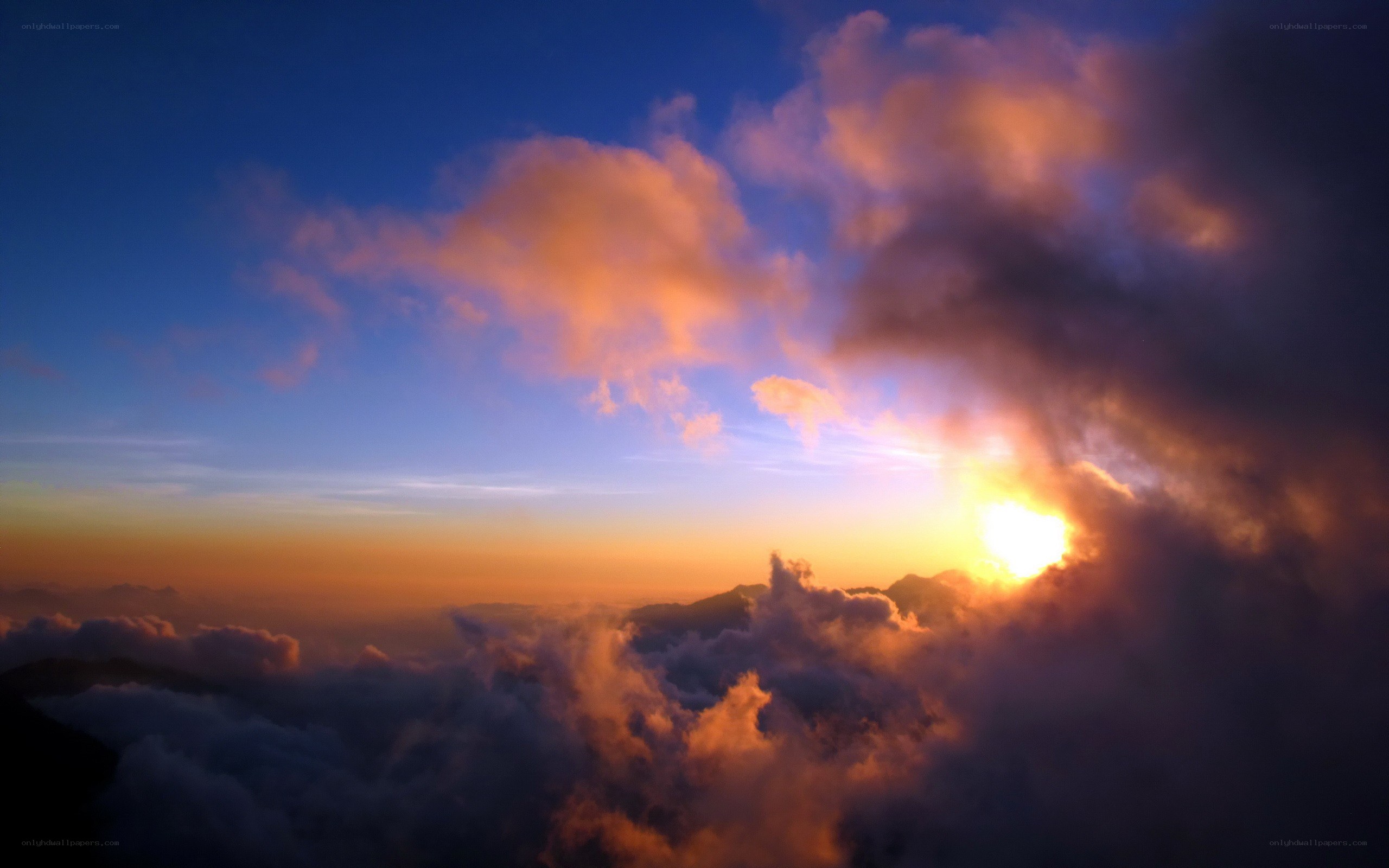 Sunrise over mountain clouds