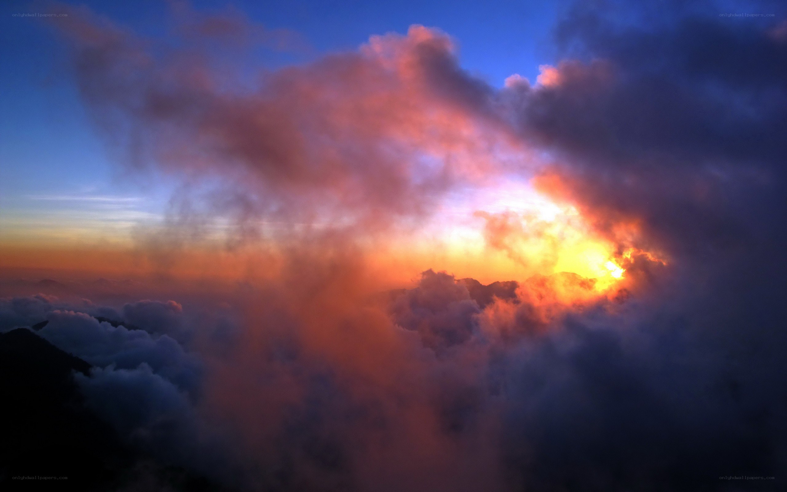 Sunrise over mountain clouds