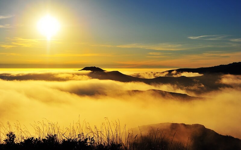 Sunrise over mountain clouds