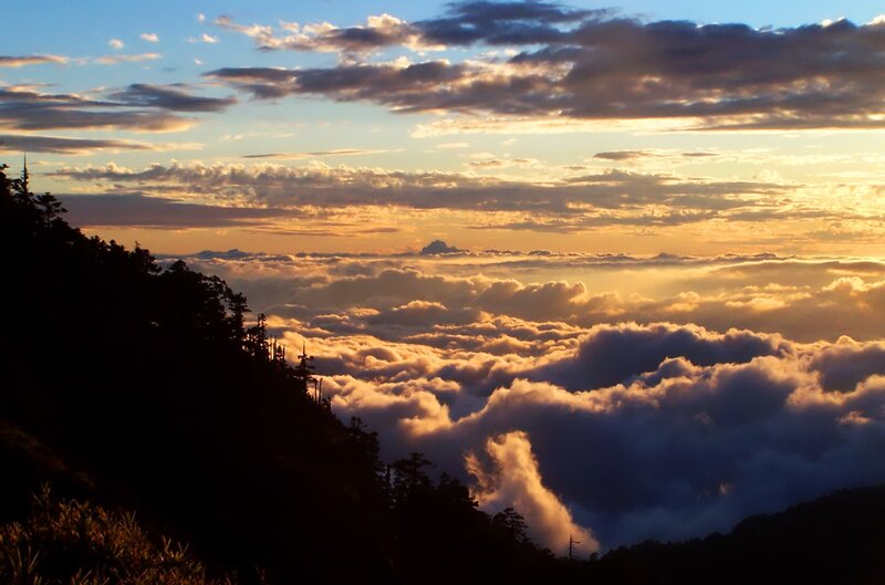 Sunrise over mountain clouds