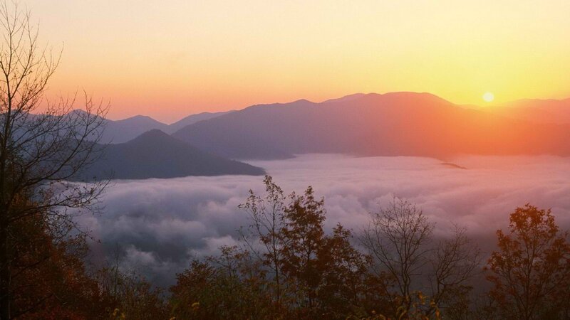 Sunrise over mountain fog