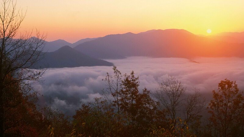Sunrise over mountain fog