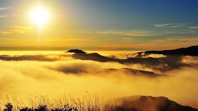 Sunrise over mountain fog