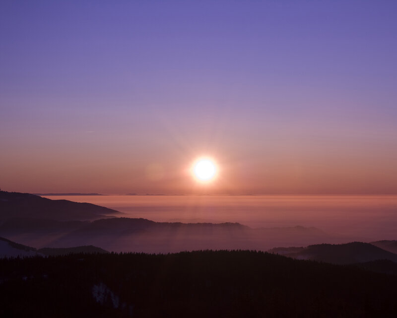 Sunrise over mountain fog