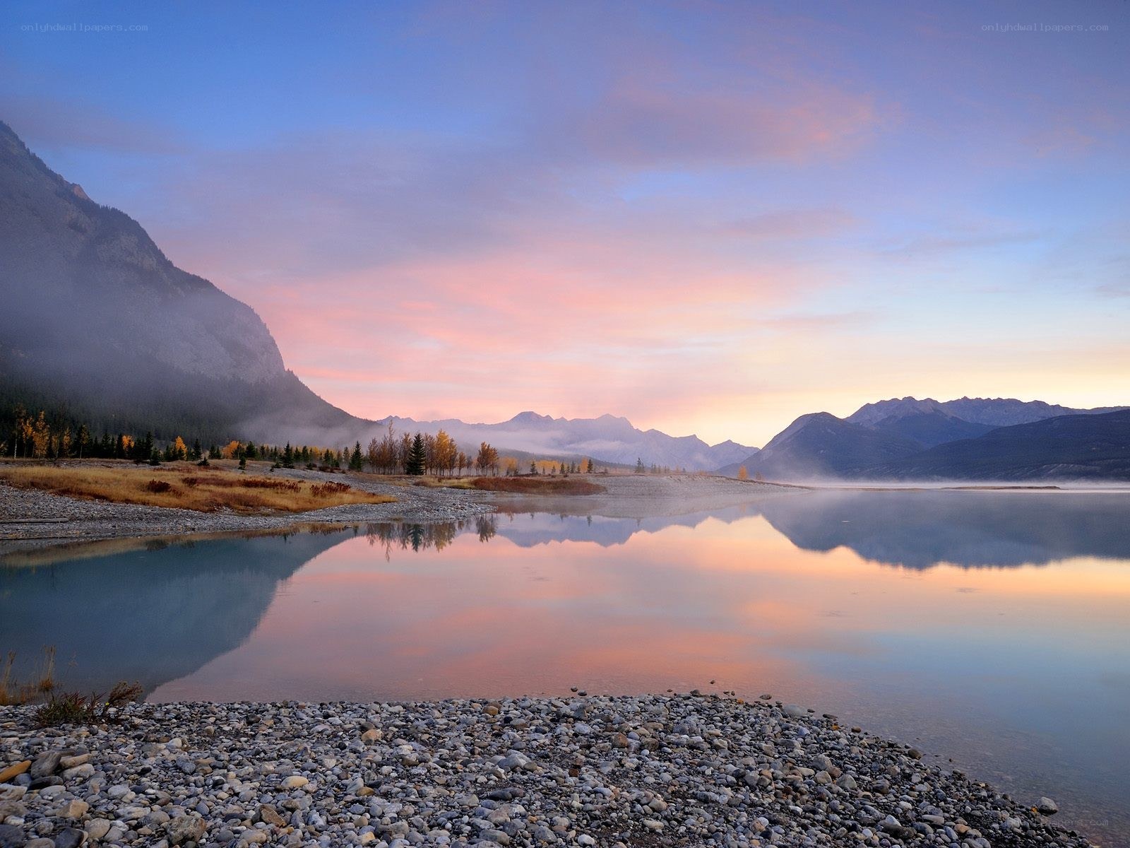 Sunrise over mountain lake