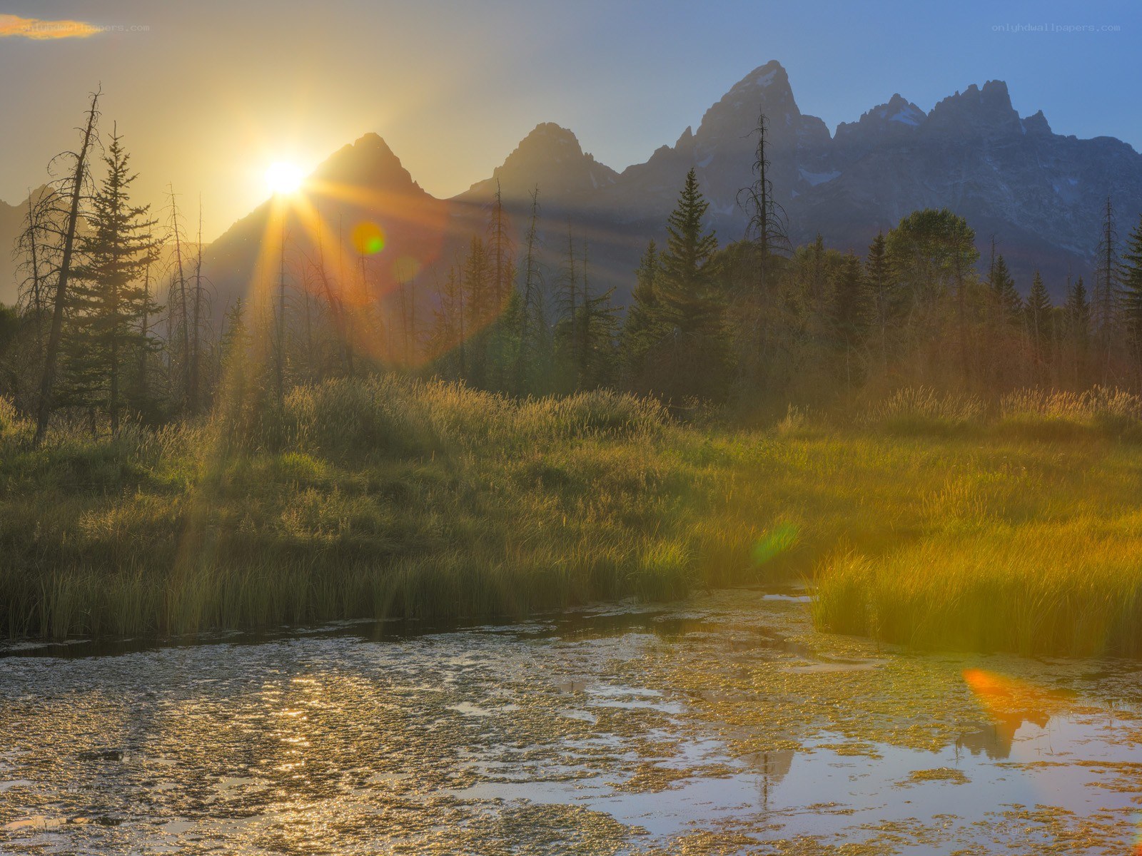 Sunrise over mountain lake
