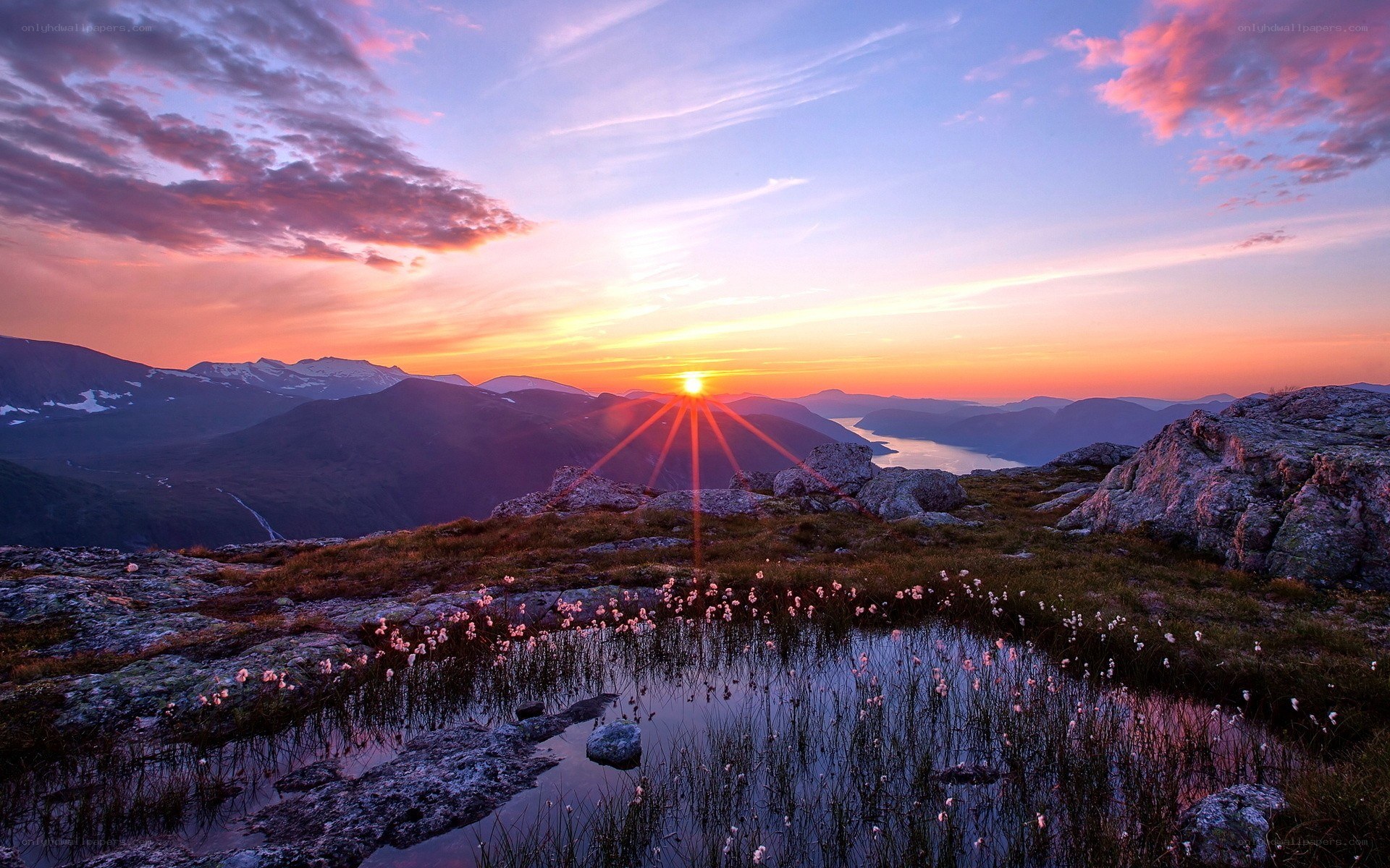 Sunrise over mountain lake