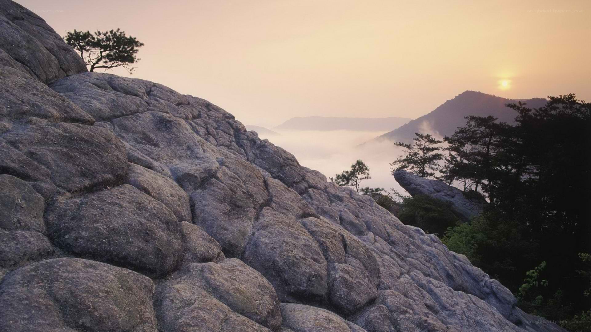Sunrise over mountain rocks