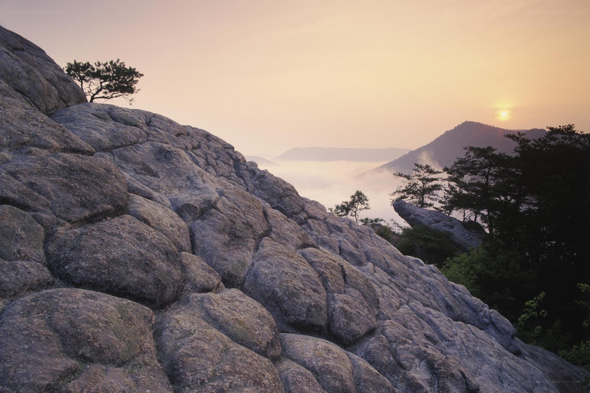 Sunrise over mountain rocks