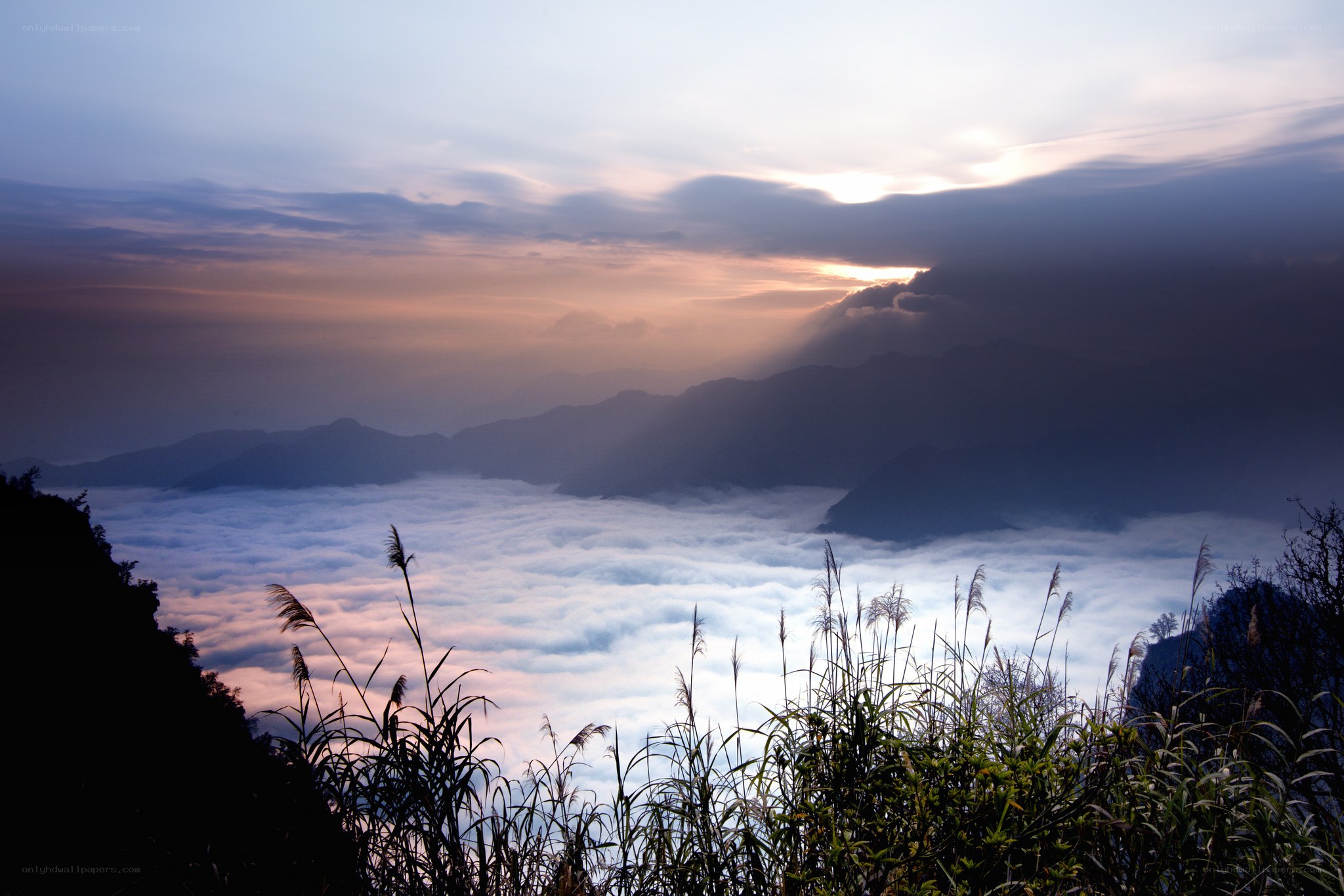 Sunrise over mountain sea of clouds