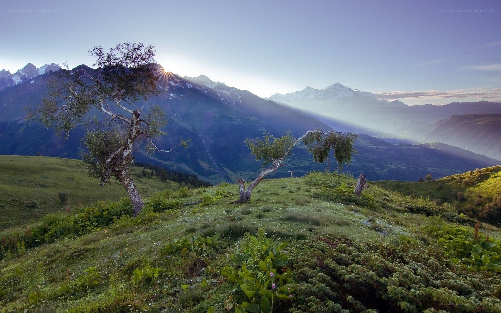 Sunrise over mountain valley