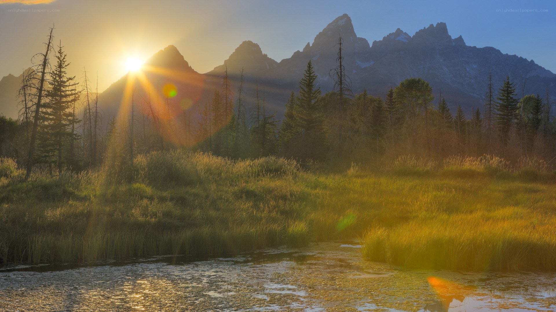 Sunrise over mountain valley