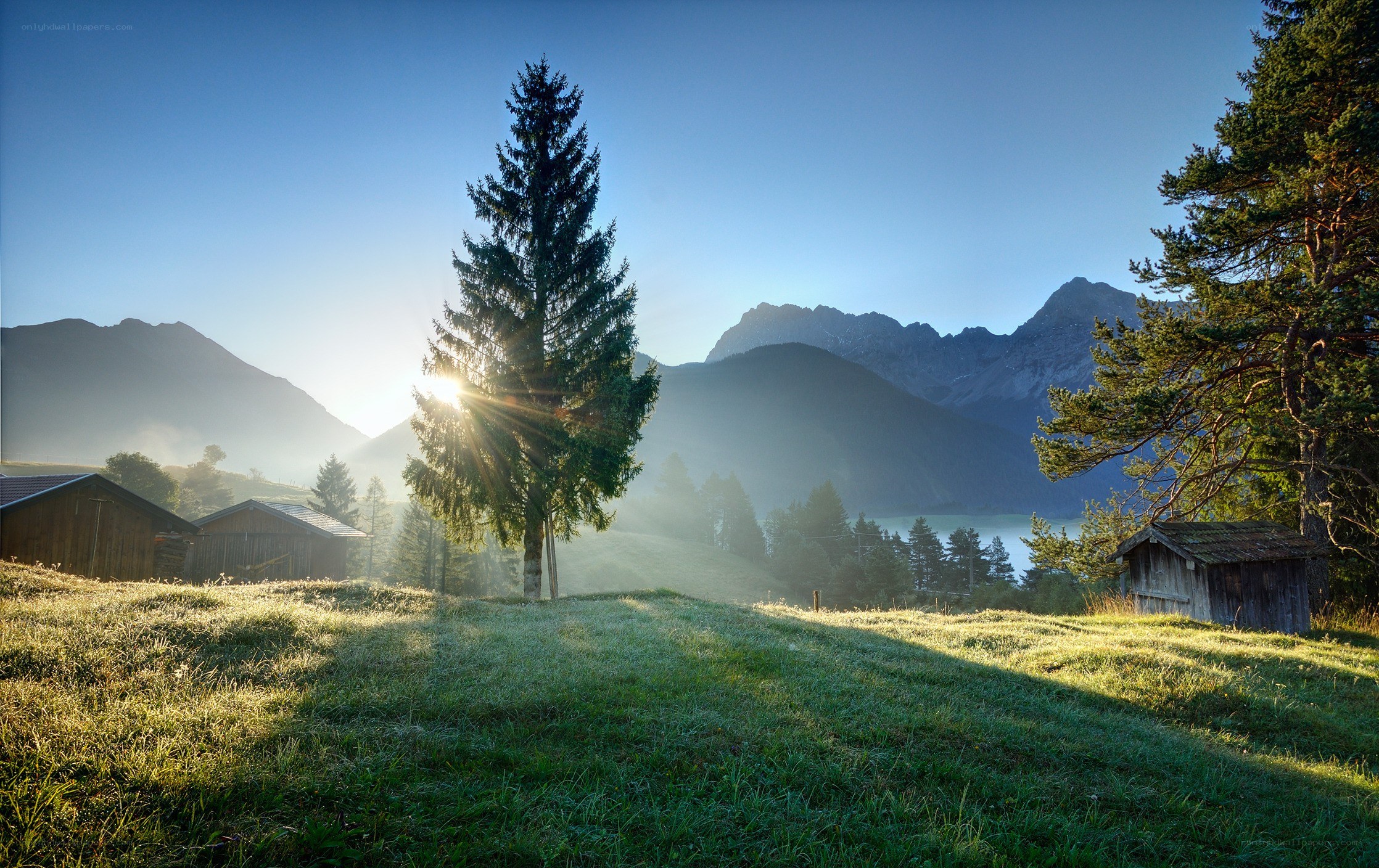 Sunrise over mountain valley