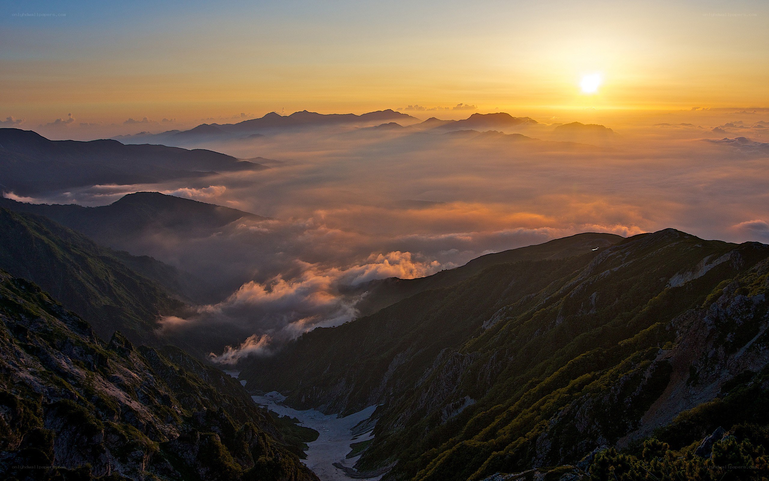 Sunrise over mountain valley