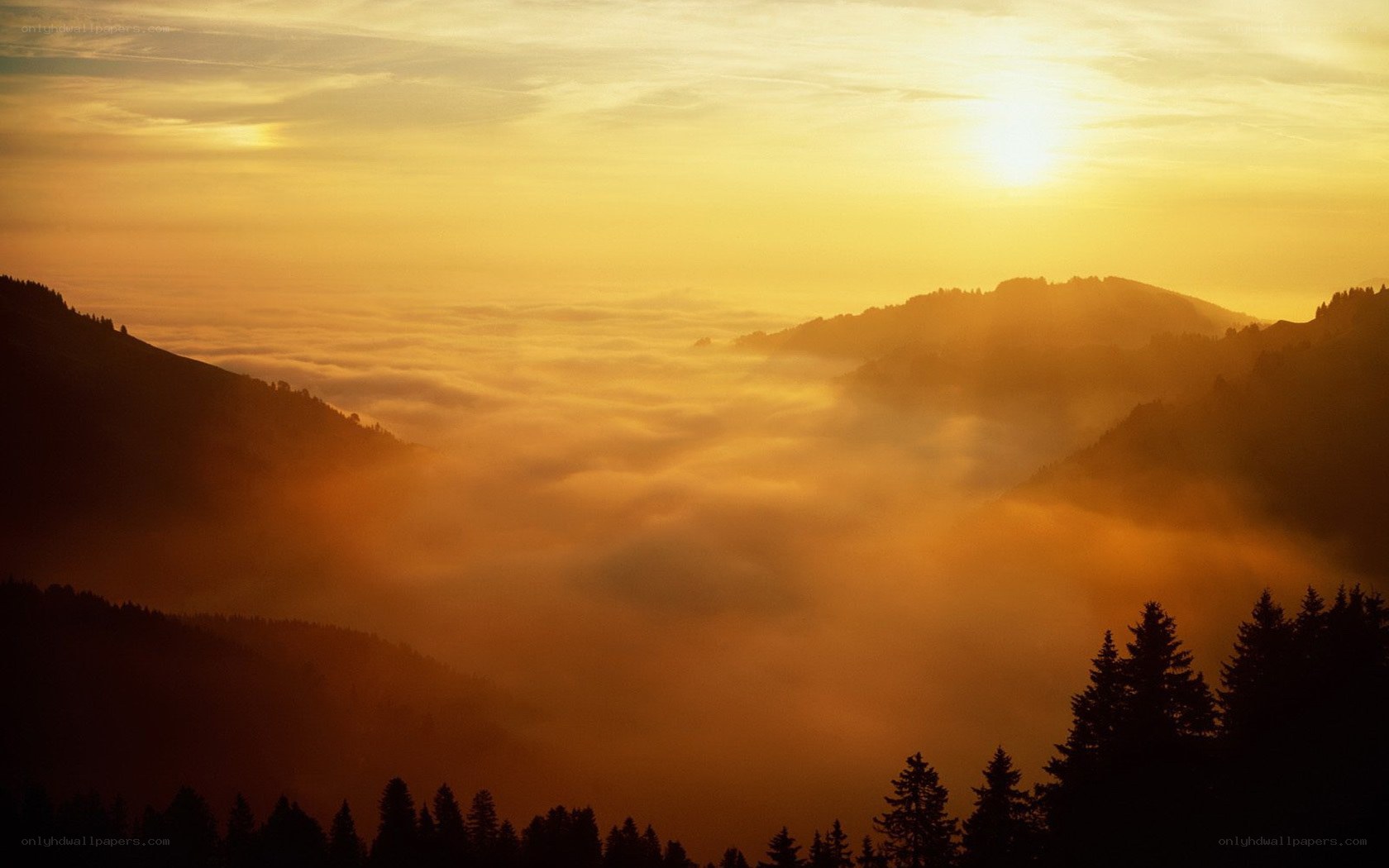 Sunrise over mountain valley
