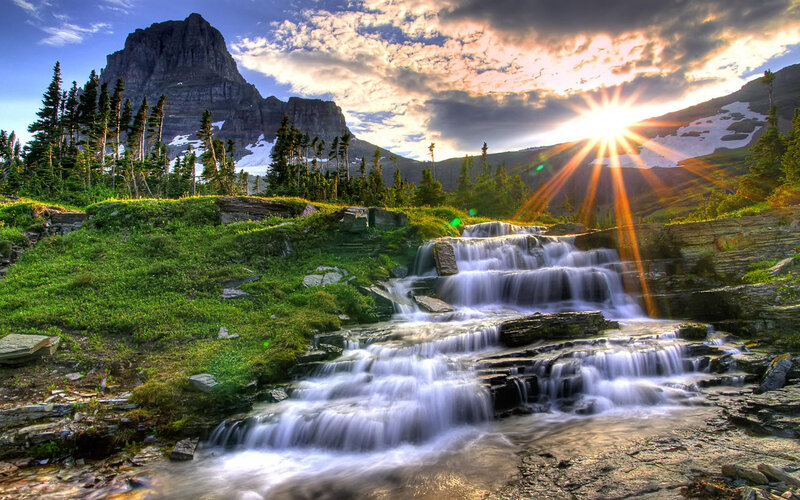 Sunrise over mountain waterfall