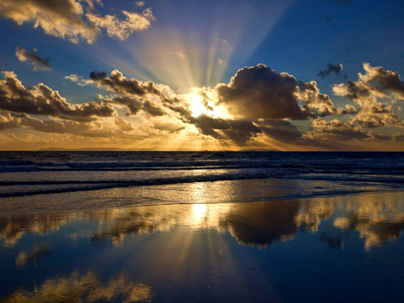 Sunrise over Ocean — Blue, Dramatic, Photograph, Clouds, Beach
