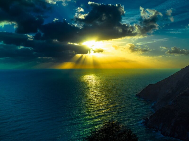 Sunrise over Ocean — Blue, Dramatic, Photograph, Clouds, Sea, Cliff