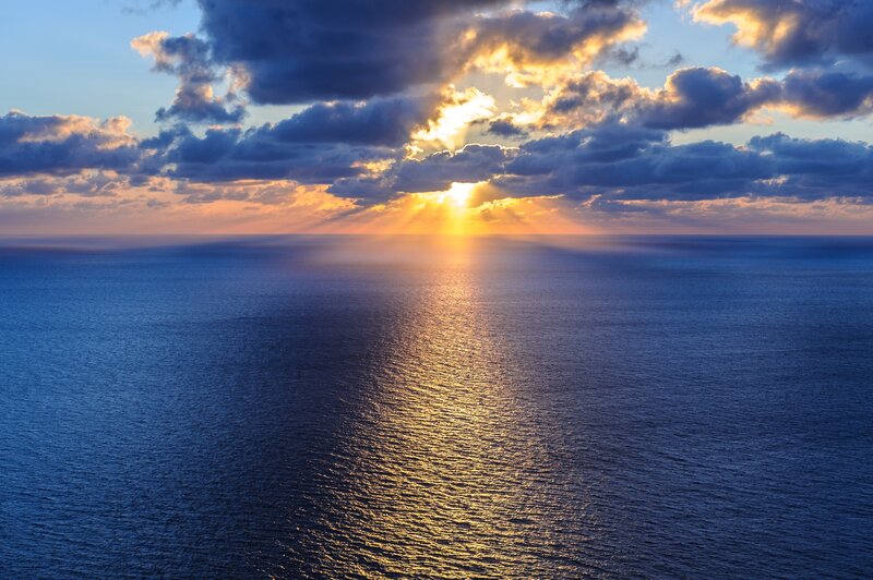 Sunrise over Ocean — Blue, Dramatic, Photograph, Clouds, Sunlight
