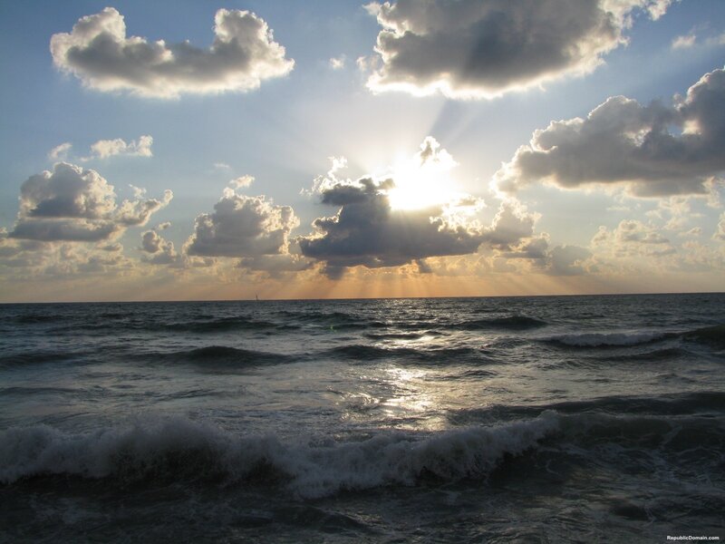 Sunrise over Ocean — Blue, Dramatic, Photograph, Clouds, Waves, Sailboat