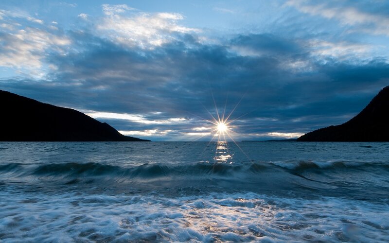 Sunrise over Ocean — Blue, Dramatic, Photograph, Mountains, Clouds