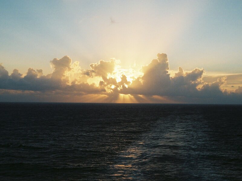 Sunrise over Ocean — Blue, Serene, Photograph, Clouds, Sunlight