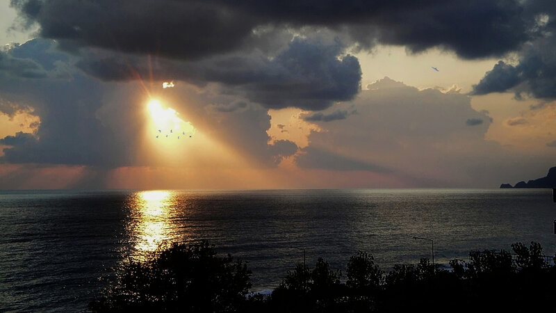 Sunrise over Ocean — Gray, Dramatic, Photograph, Clouds