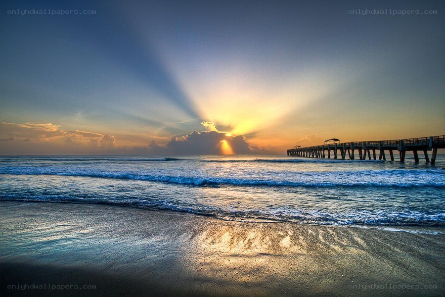 Sunrise over ocean pier
