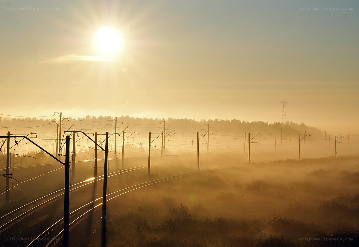 Sunrise over railway tracks
