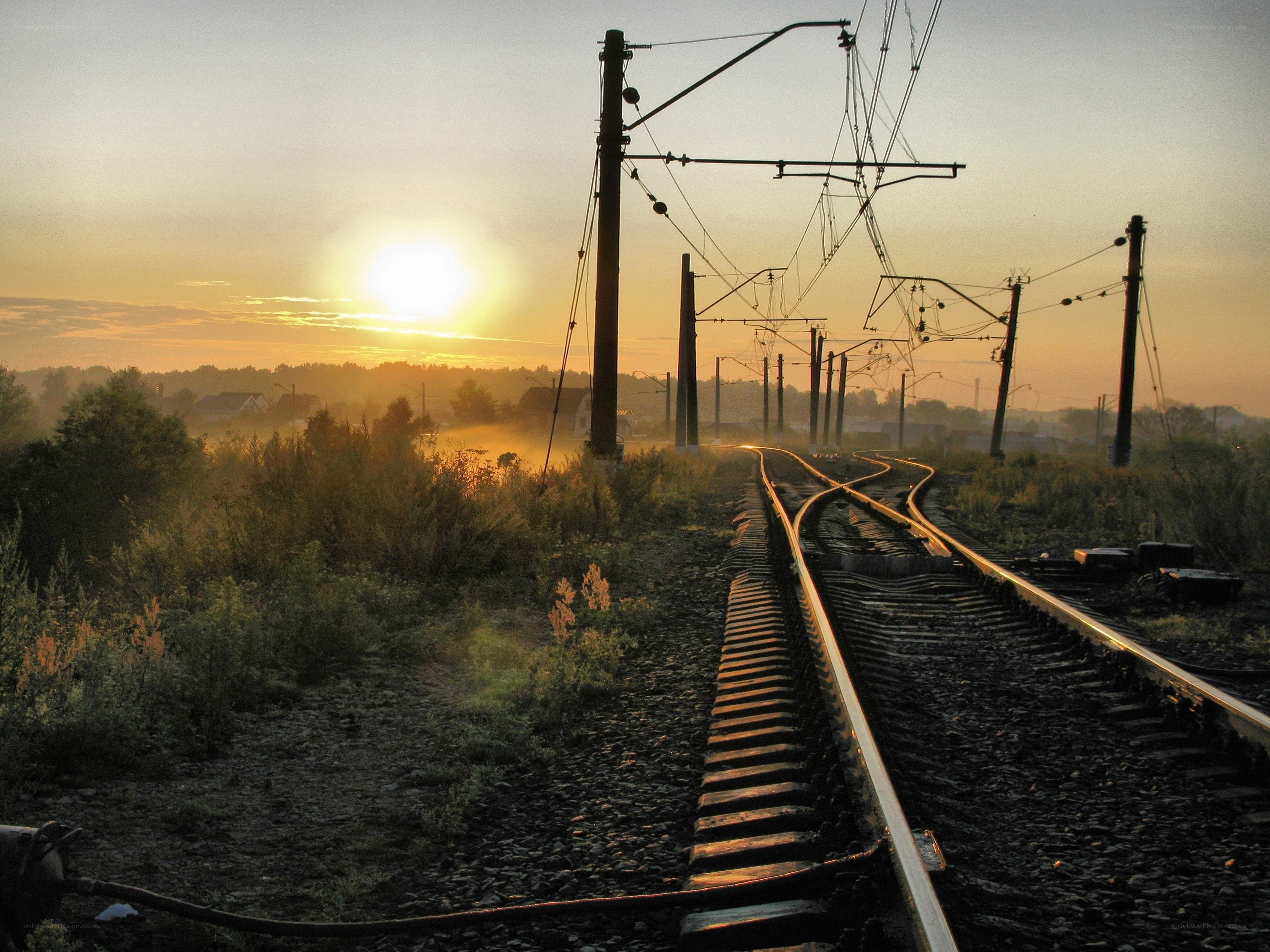 Sunrise over railway tracks