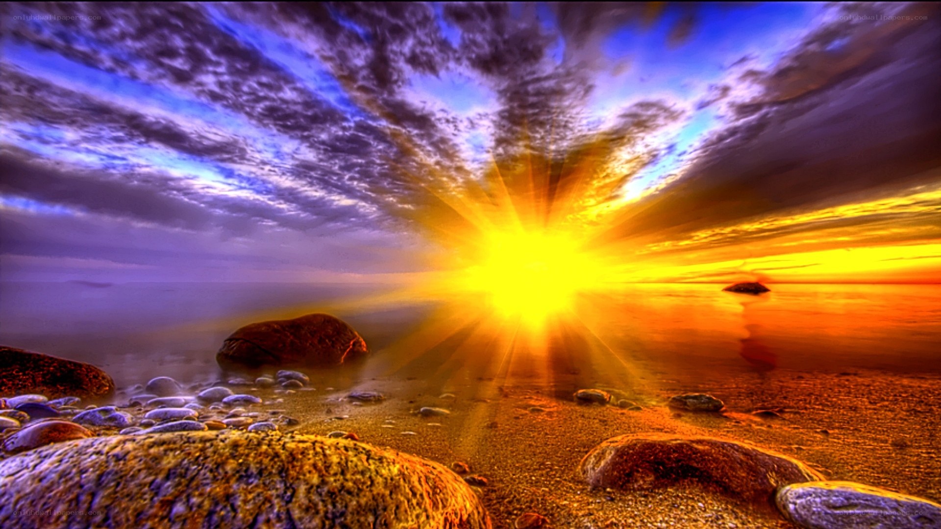Sunrise over rocky beach