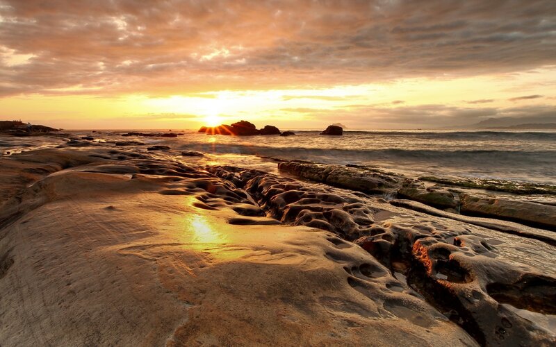 Sunrise over Rocky Beach — Orange, Serene, Photograph