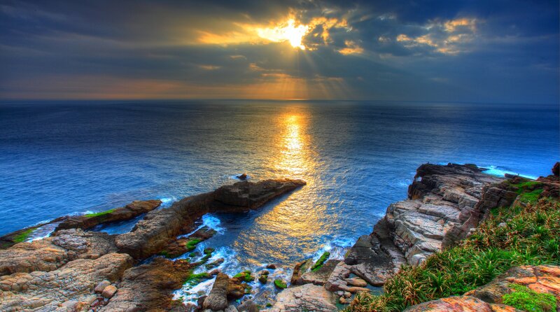 Sunrise over Rocky Coastline — Blue
