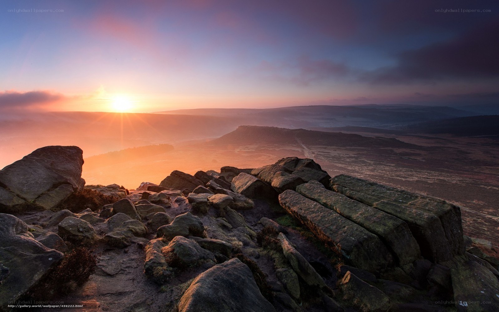 Sunrise over rocky hills