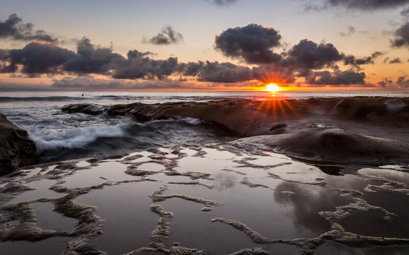Sunrise over Rocky Shore — Orange, Dramatic, Photograph, Ocean, Clouds