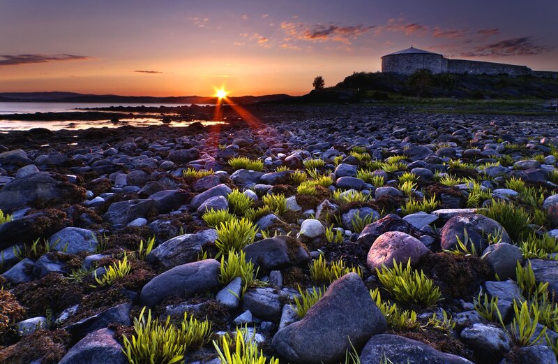 Sunrise over Rocky Shore — Orange, Serene