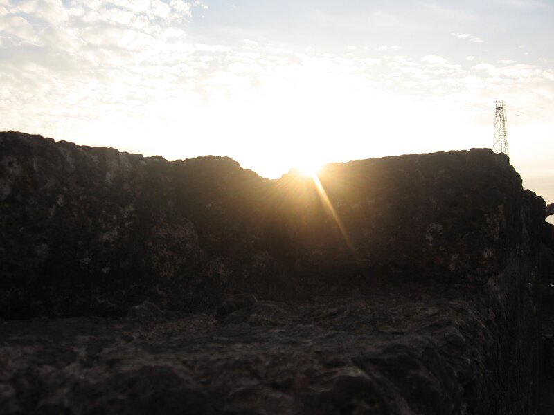 Sunrise over rocky wall
