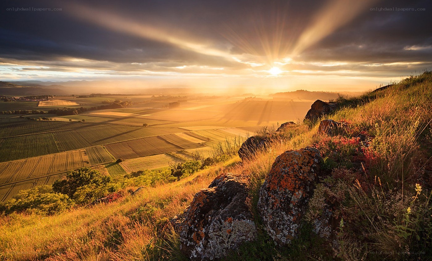 Sunrise over rolling hills