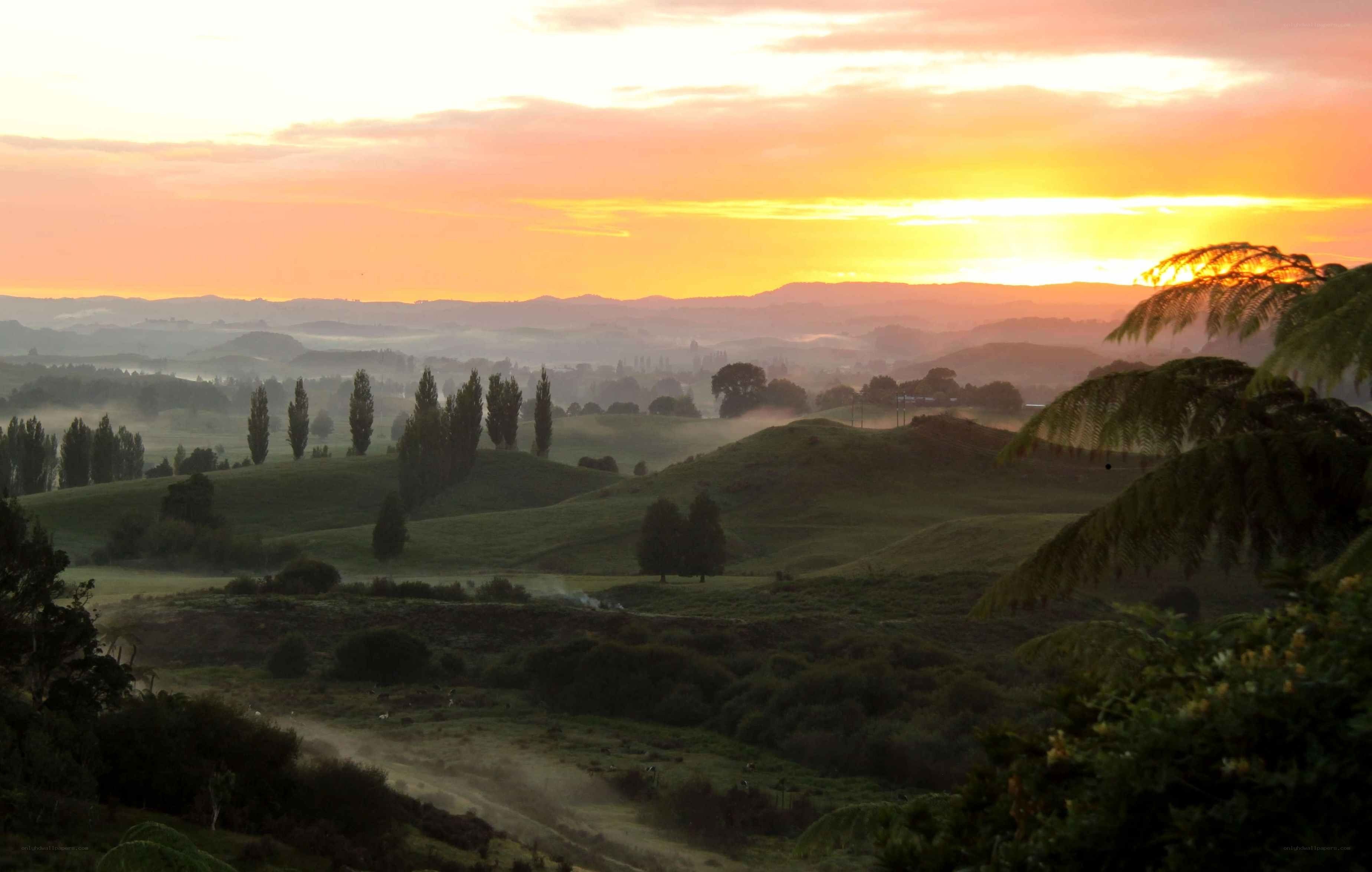 Sunrise over rolling hills