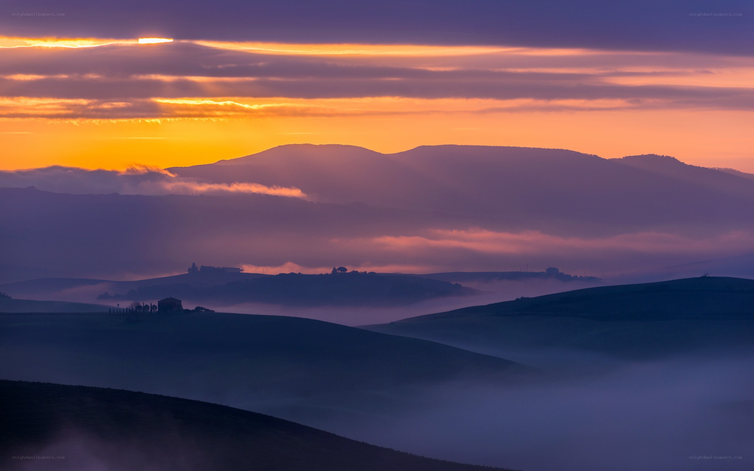 Sunrise over rolling hills