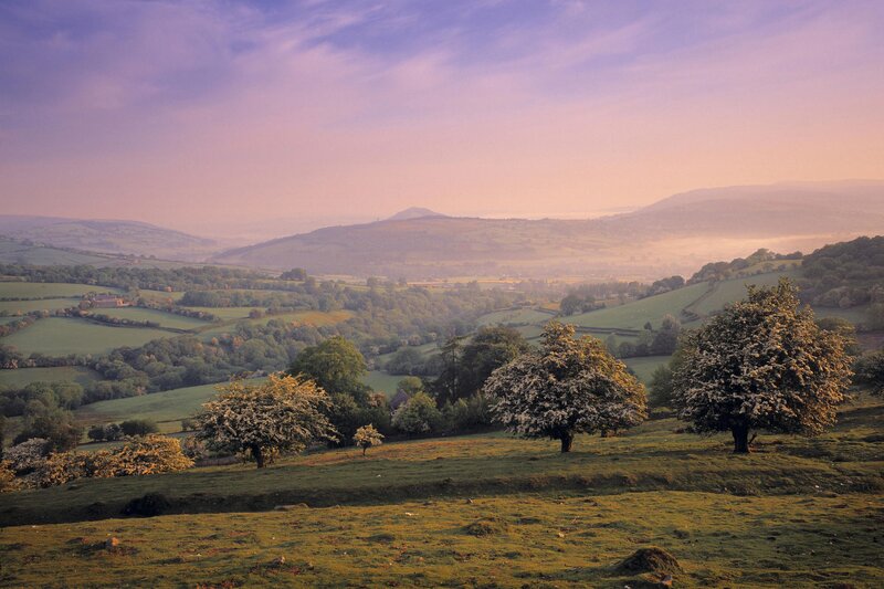 Sunrise over rolling hills